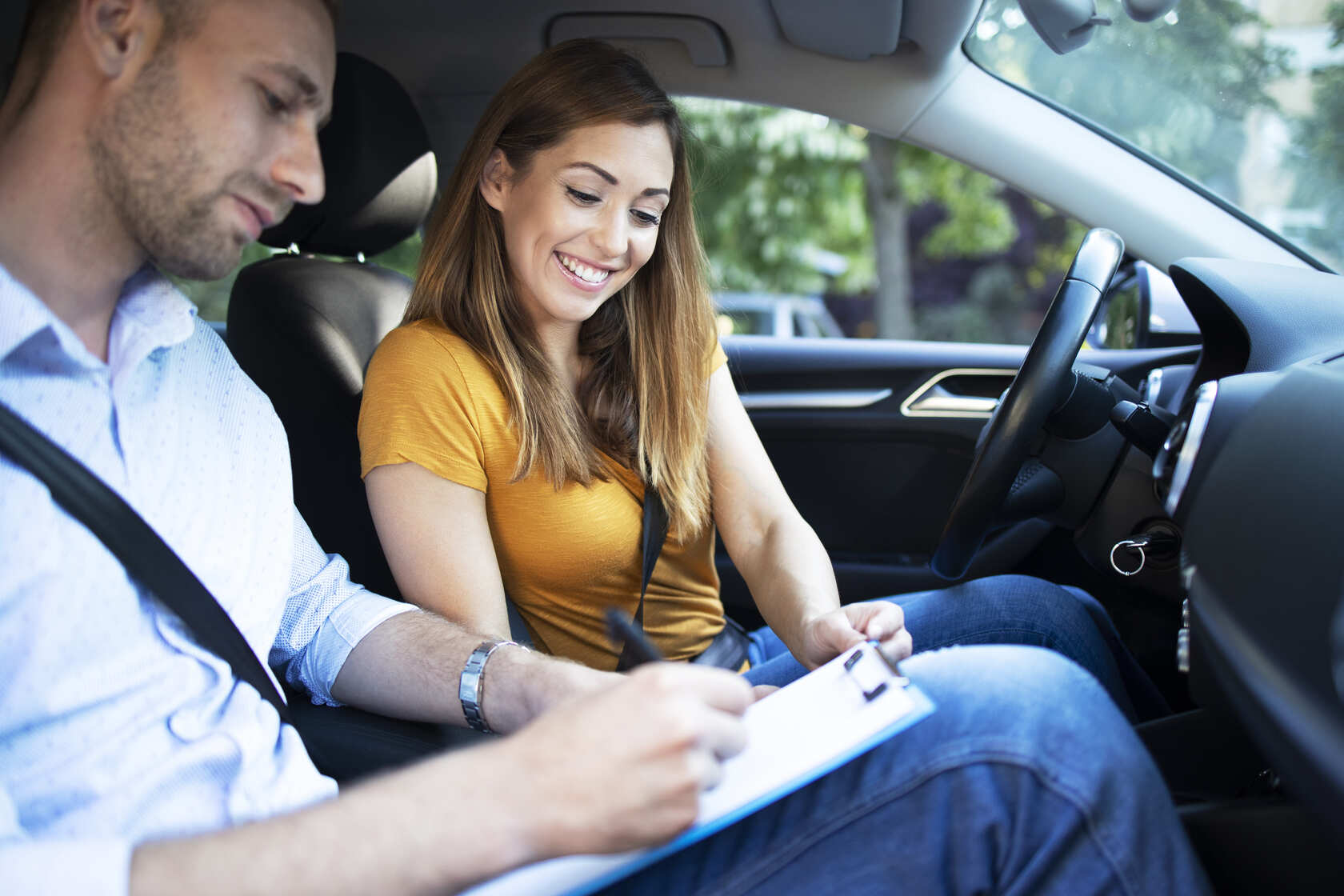 car-instructor-explaining-city-traffic-rules-before-driving-car (1) (1)